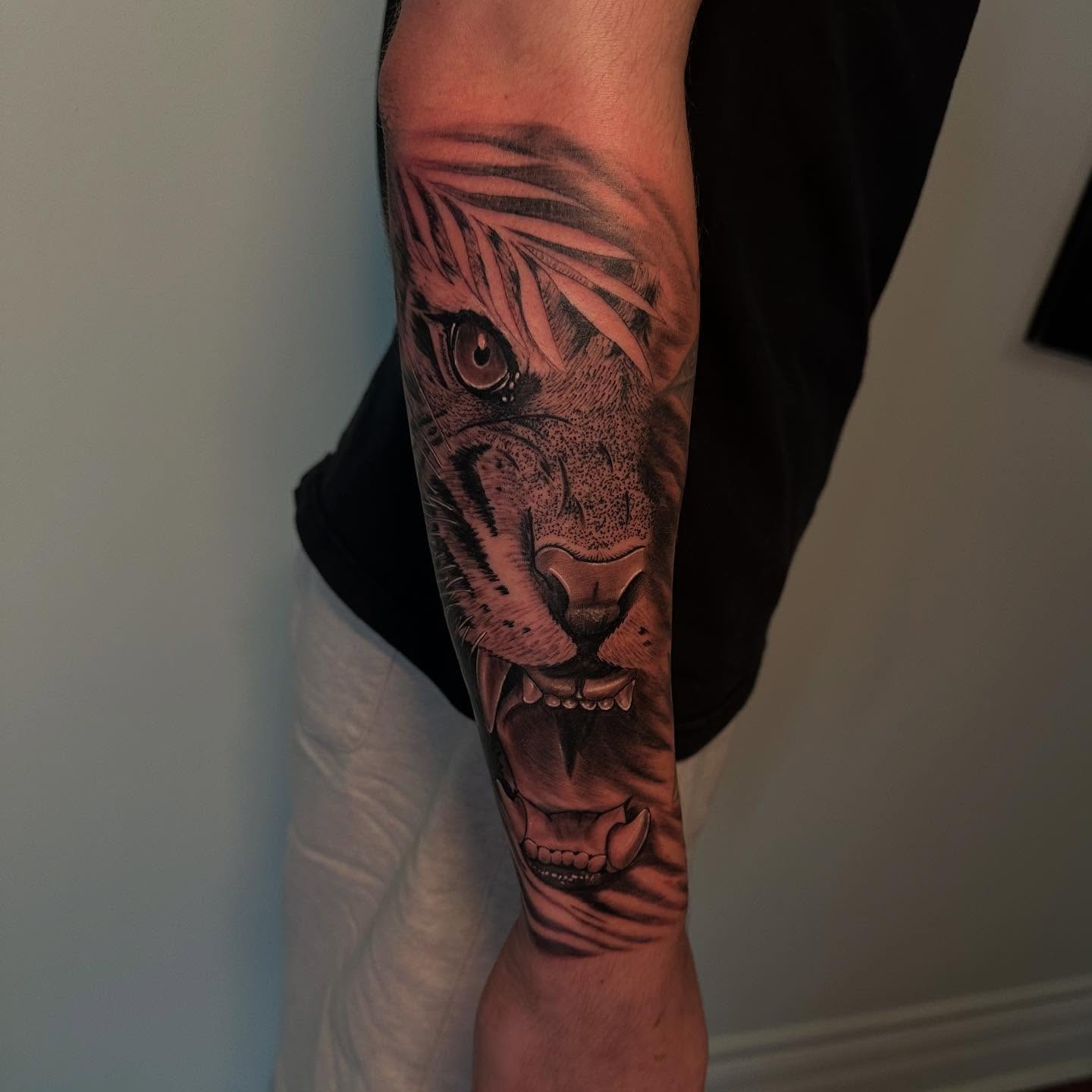 Roaring tiger fine-line blackwork tattoo sleeve
